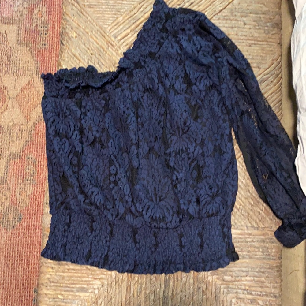 Small, asymmetrical lace top